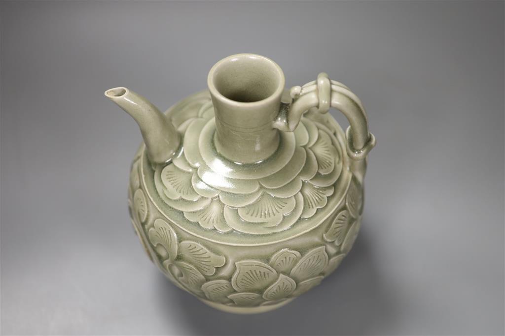 A Chinese carved celadon ewer, 16cm high